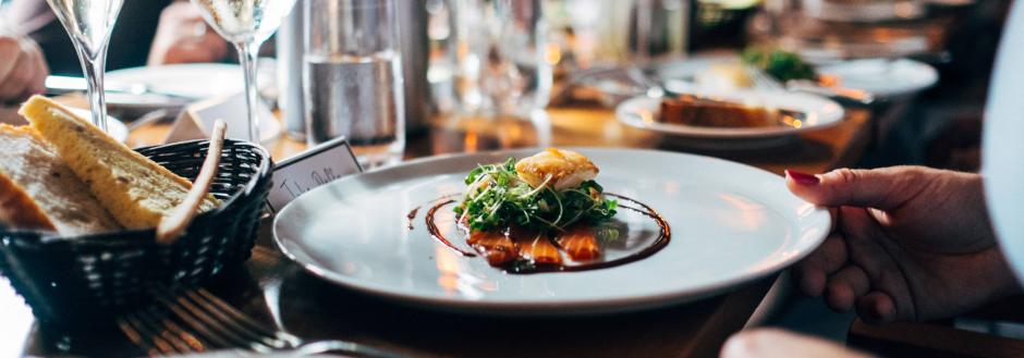 Wine glasses and appetizers at a food event