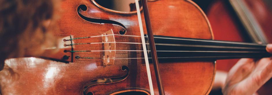 Close up of an instrument being played in a symphony