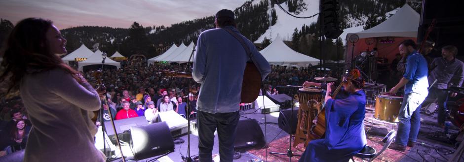 People playing live music on stage at Winter Wondergrass Festival