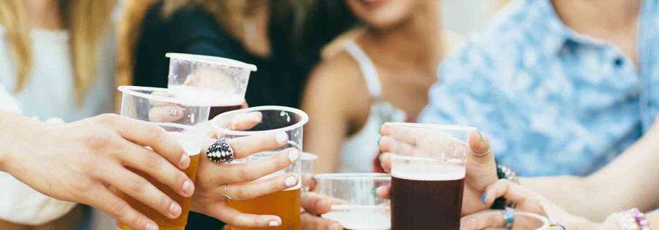 Friends toasting together at a beer festival