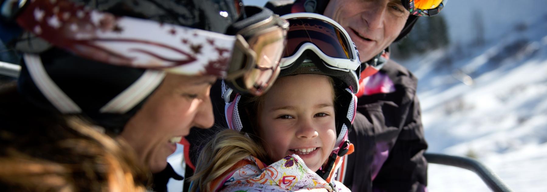 Smiling Family on the Chairlift