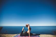 Yogi doing yoga in front of Lake Tahoe