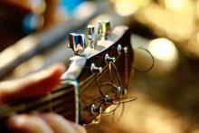 Close up of a guitar being played