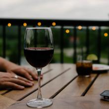 Glass of red wine at table. 